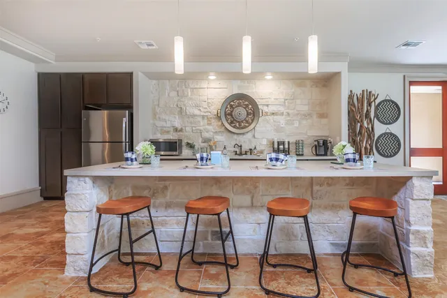 a living room with furniture fireplace and a flat screen tv