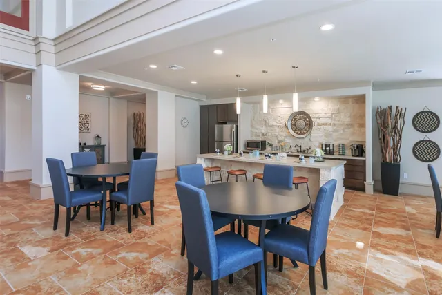 a view of a workspace with a computer on a desk chair and a computer on the desk