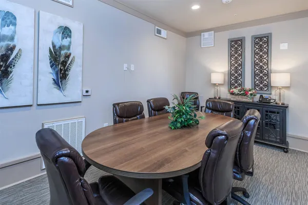 a dining room with furniture and window