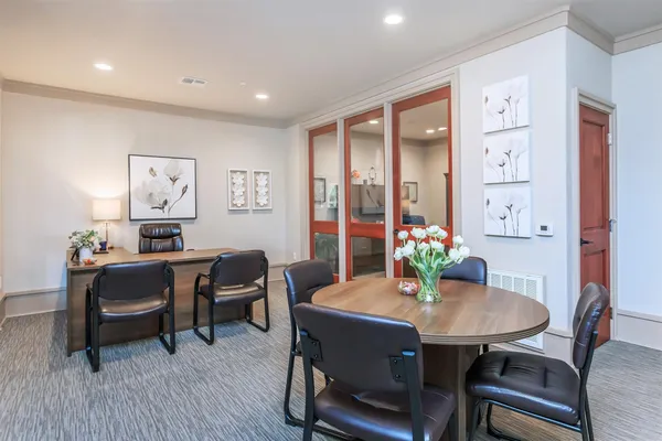 a bedroom with furniture and a fireplace
