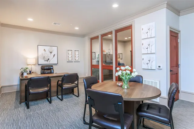 a bedroom with furniture and a fireplace