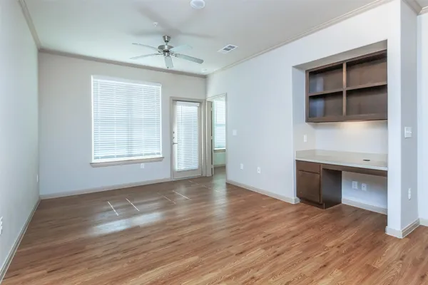 a view of a kitchen with a sink and a refrigerator