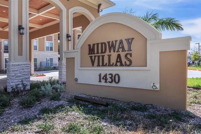 a sign that is on the side of the building