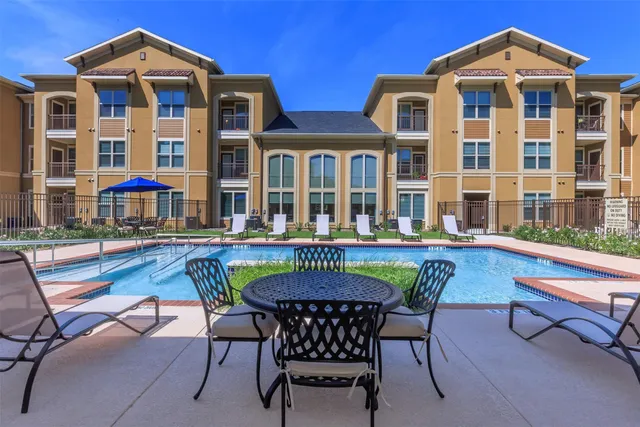 a view of a chairs and table in the patio