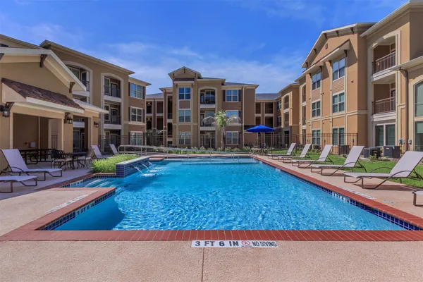 a living room with lots of furniture and a rug