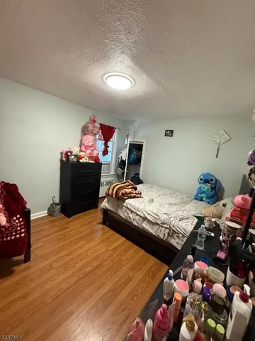 a bedroom with bed and window