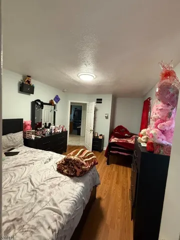 a bedroom with bed and window