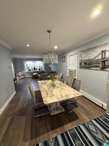 a large kitchen with a table and chairs
