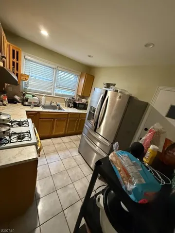 a kitchen with a stove and a refrigerator