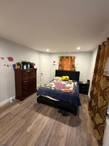 a bedroom with a bed and dresser