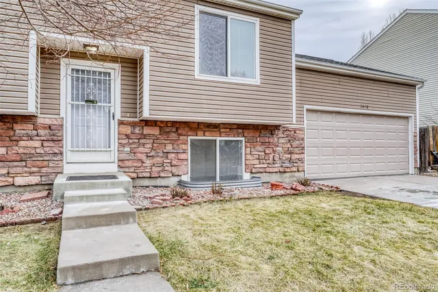 a front view of a house with a garage