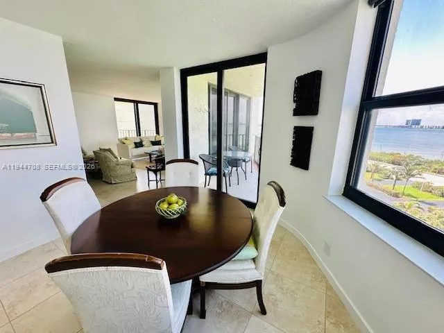 a view of a dining room with furniture and window