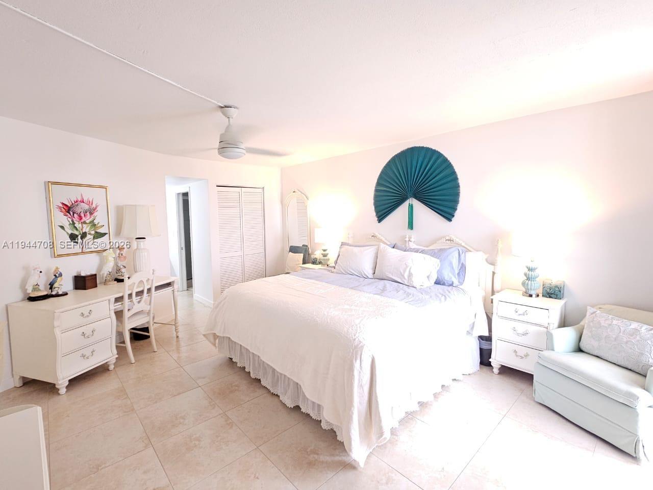 5420 North Ocean Drive, Unit 706 Singer Island, FL 33404 - Photo 18 of 41 a bedroom with a bed and a couch