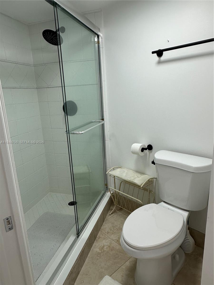 5420 North Ocean Drive, Unit 706 Singer Island, FL 33404 - Photo 21 of 41 a bathroom with a toilet and a shower