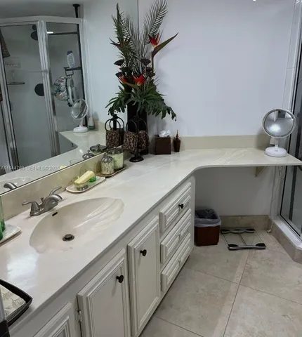 a bathroom with a sink and a mirror