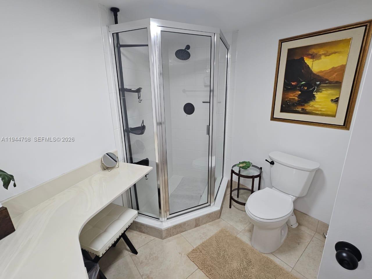 5420 North Ocean Drive, Unit 706 Singer Island, FL 33404 - Photo 25 of 41 a bathroom with a toilet and a shower