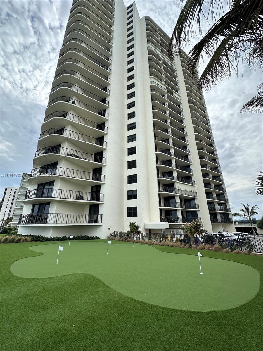 5420 North Ocean Drive, Unit 706 Singer Island, FL 33404 - Photo 29 of 41 a view of a large building with a yard