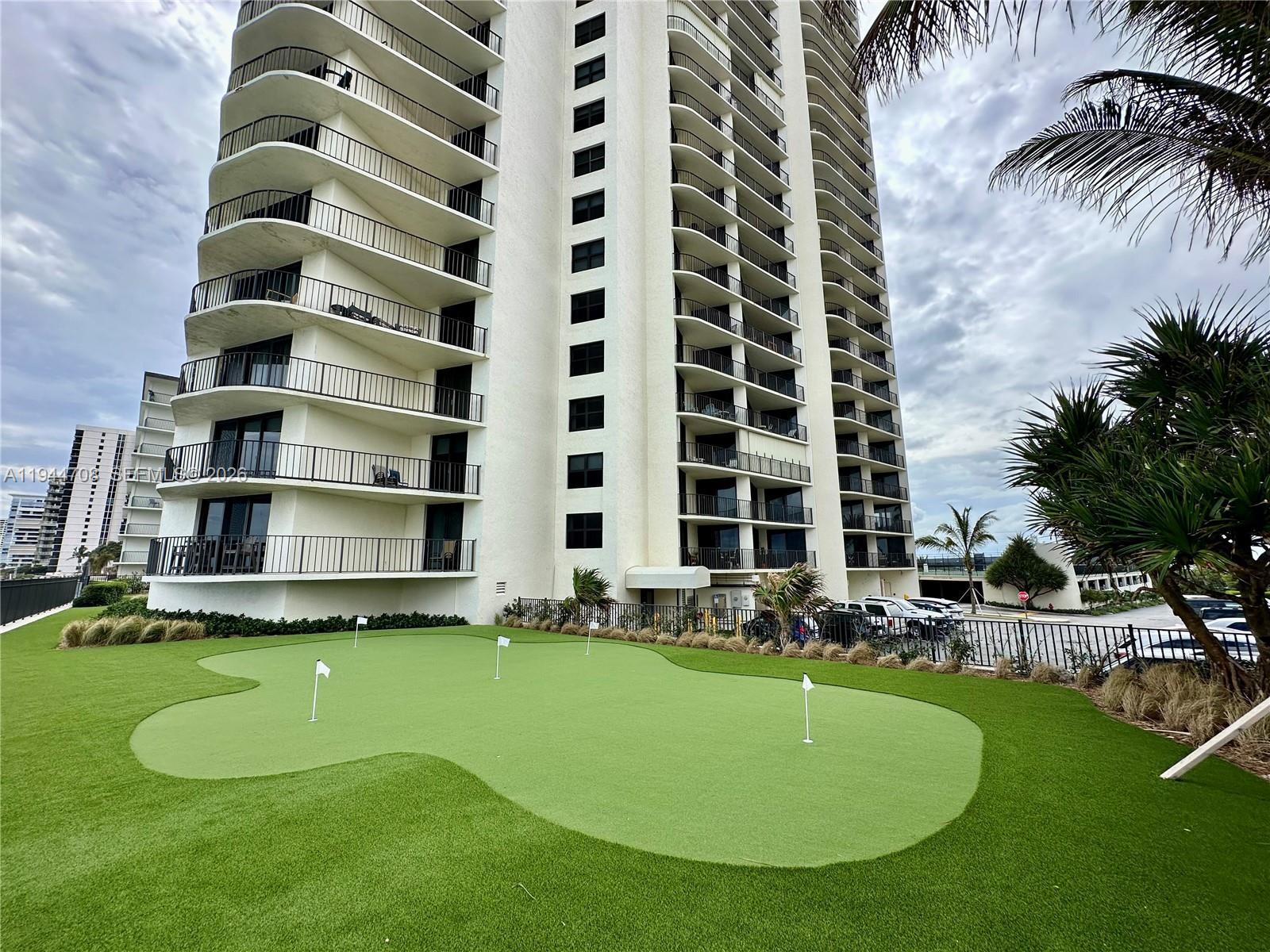 5420 North Ocean Drive, Unit 706 Singer Island, FL 33404 - Photo 30 of 41 a front view of building with yard
