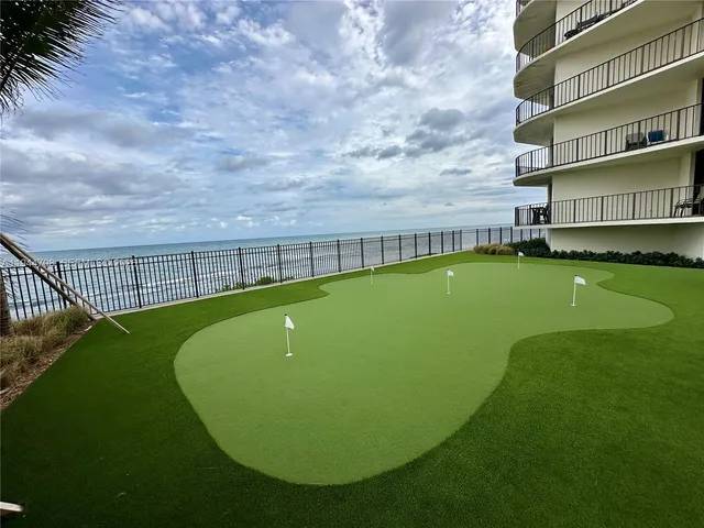 a view of a swimming pool with a garden