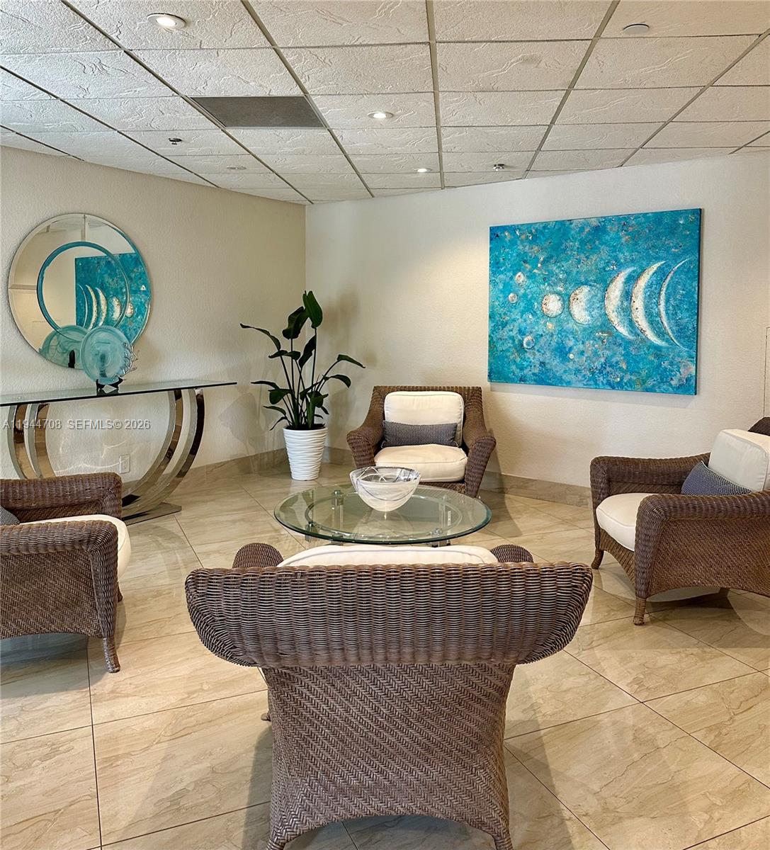 5420 North Ocean Drive, Unit 706 Singer Island, FL 33404 - Photo 39 of 41 a living room with furniture and a wooden floor