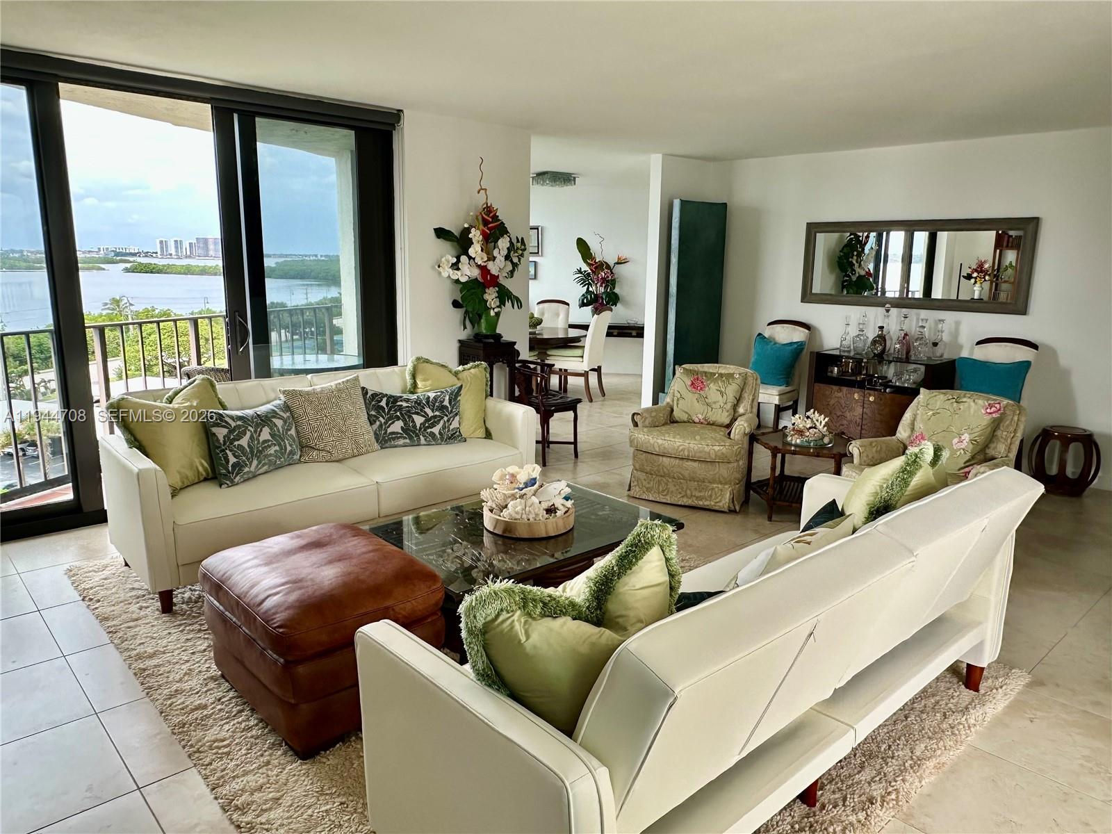 5420 North Ocean Drive, Unit 706 Singer Island, FL 33404 - Photo 7 of 41 a living room with furniture and a large window