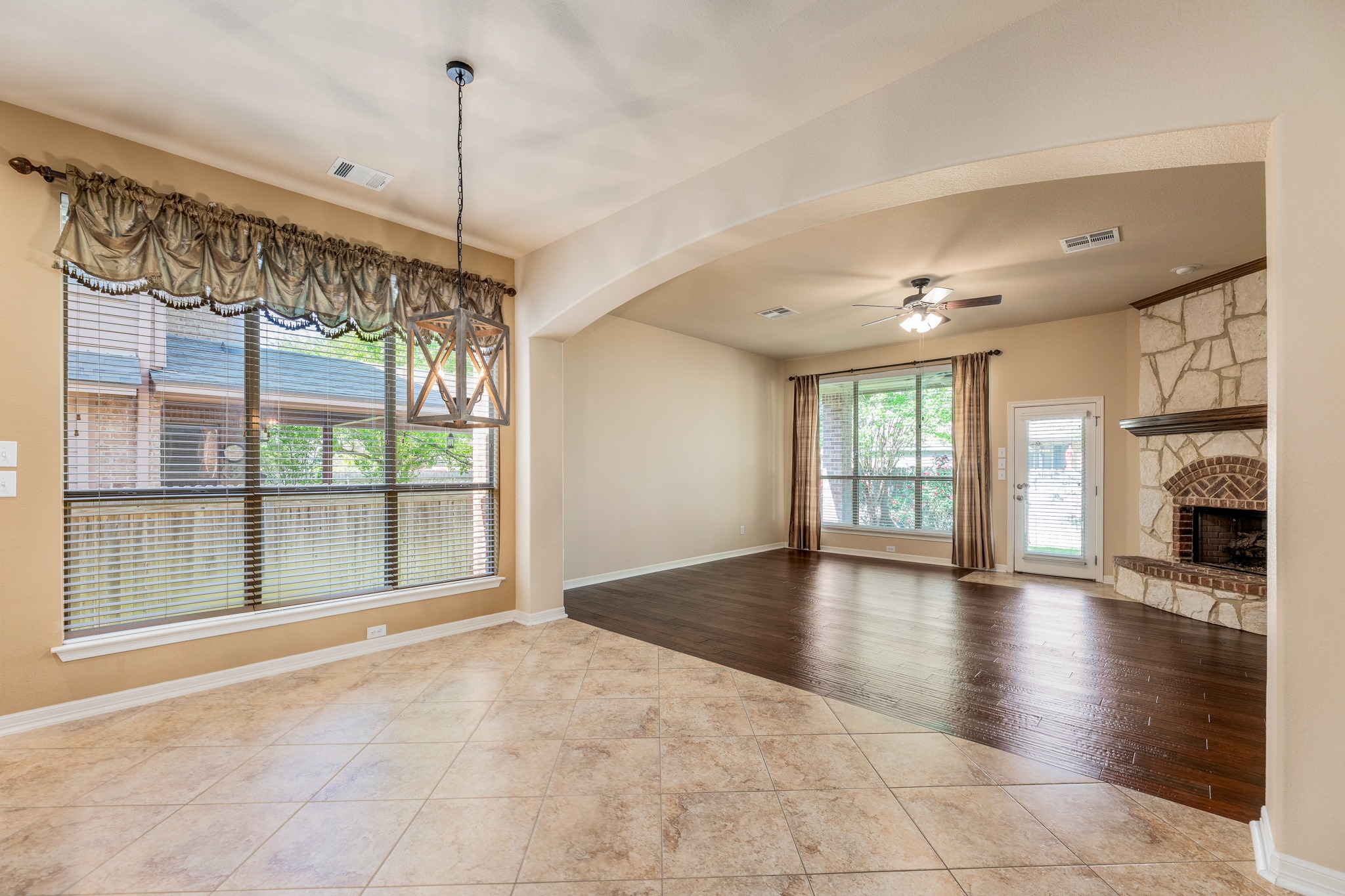 20804 Windmill Ridge Street Pflugerville, TX 78660 - Photo 14 of 40 The sunny dining area offers ample space for a large kitchen table and more alongside picture windows.