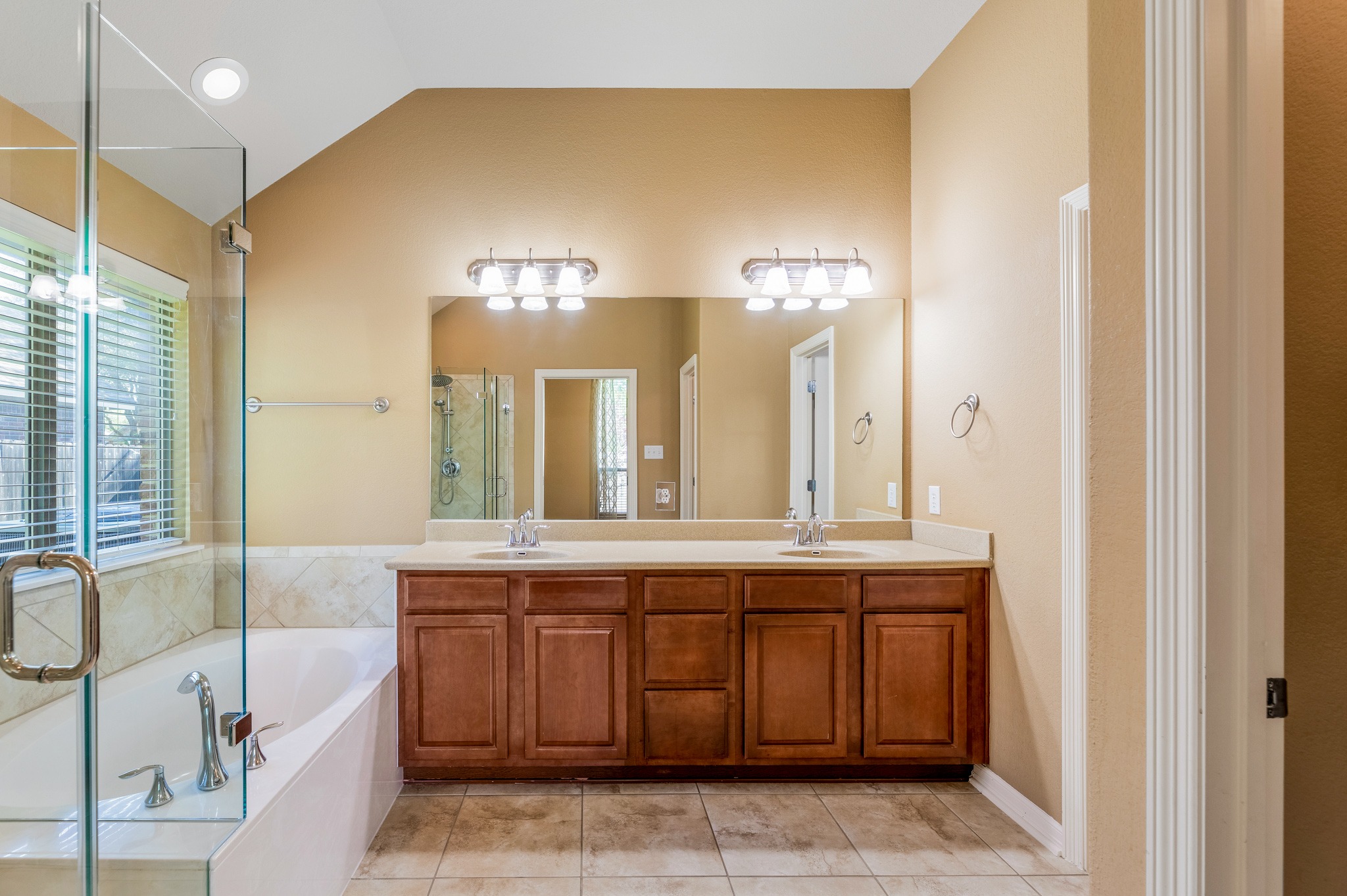 20804 Windmill Ridge Street Pflugerville, TX 78660 - Photo 20 of 40 Double doors open into the private primary ensuite bath with the walk-in closet and private toilet.