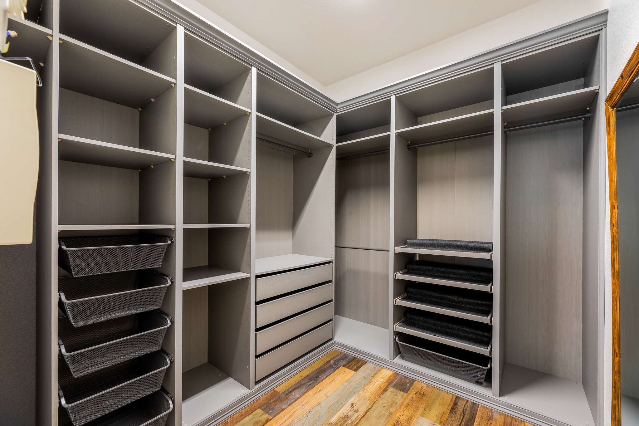 20804 Windmill Ridge Street Pflugerville, TX 78660 - Photo 23 of 40 The walk-in closet is a showstopper with a custom built-in organizational system.