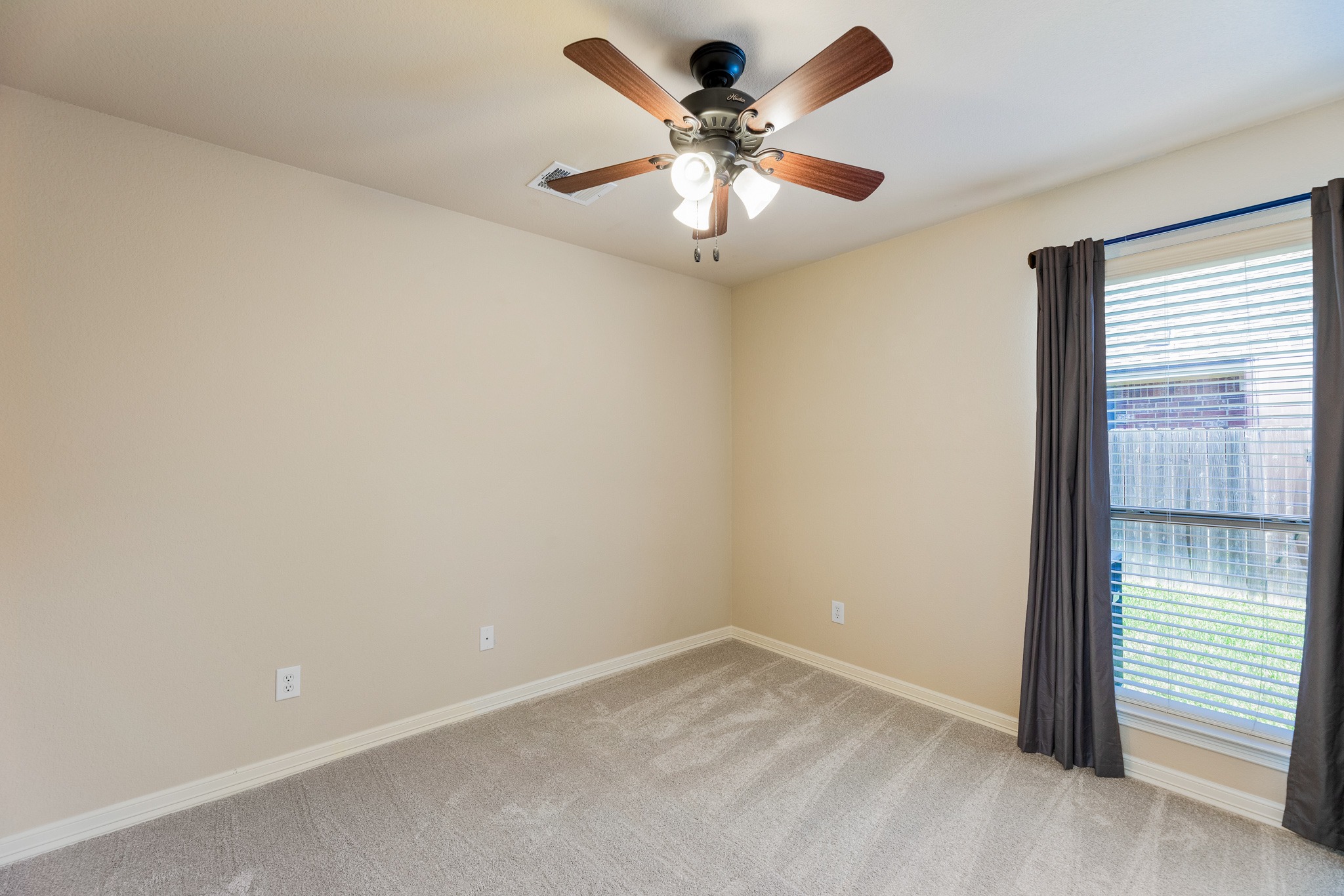20804 Windmill Ridge Street Pflugerville, TX 78660 - Photo 26 of 40 Two additional bedrooms are tucked away in their own hallway on the main floor.