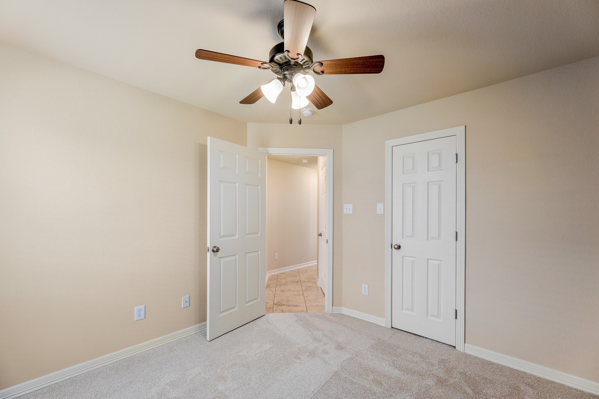 20804 Windmill Ridge Street Pflugerville, TX 78660 - Photo 27 of 40 Both secondary bedrooms come with carpeting, ceiling fans, and closet storage.