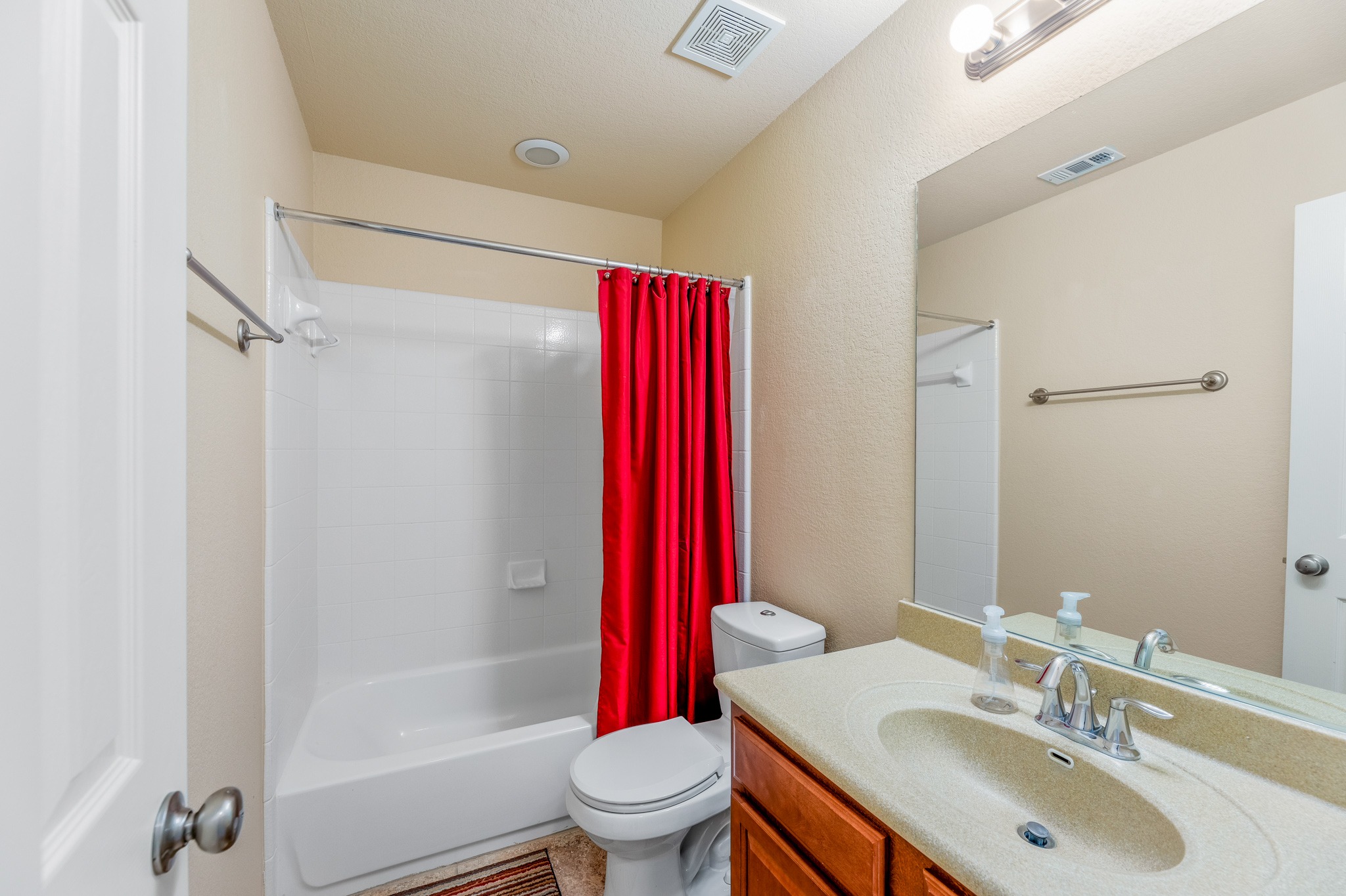 20804 Windmill Ridge Street Pflugerville, TX 78660 - Photo 32 of 40 The full guest bathroom upstairs comes with a shower/tub combo.