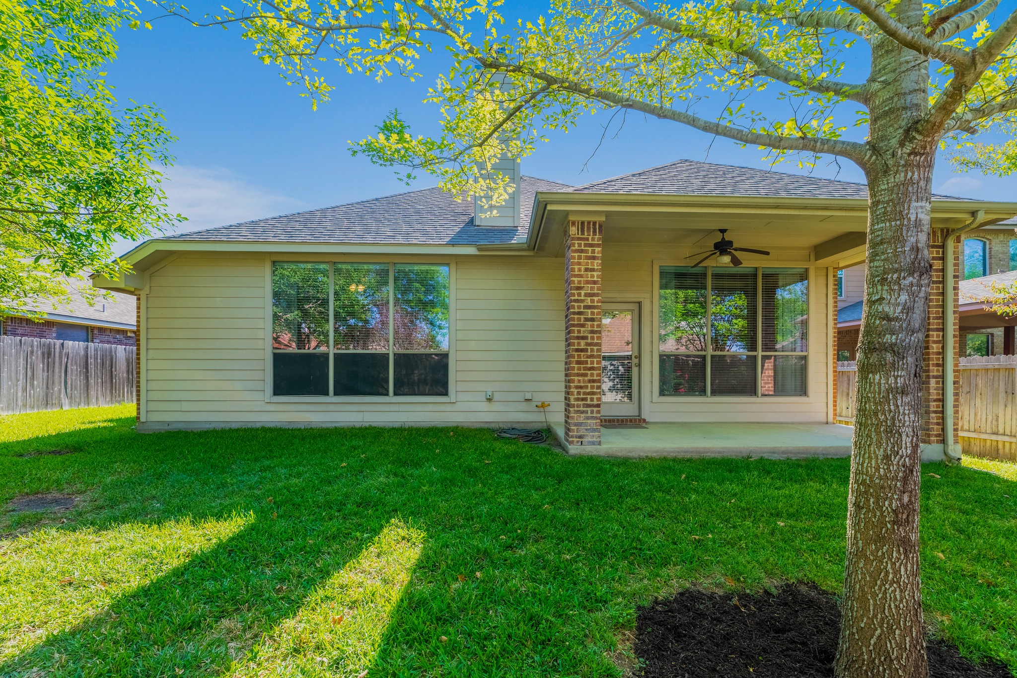 20804 Windmill Ridge Street Pflugerville, TX 78660 - Photo 35 of 40 The lush lawn is easy maintenance with in ground automatic irrigation.