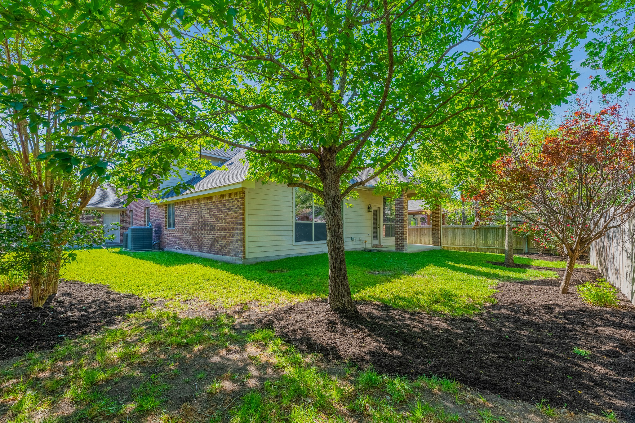 20804 Windmill Ridge Street Pflugerville, TX 78660 - Photo 37 of 40 The fenced-yard offers ample space to play and grow.