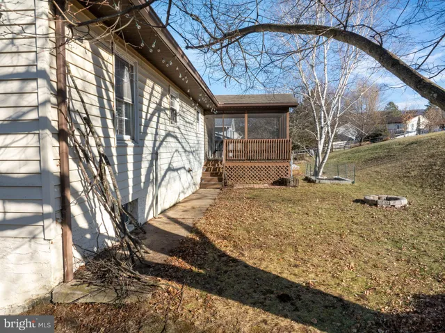 a view of entryway with wooden floor and windows