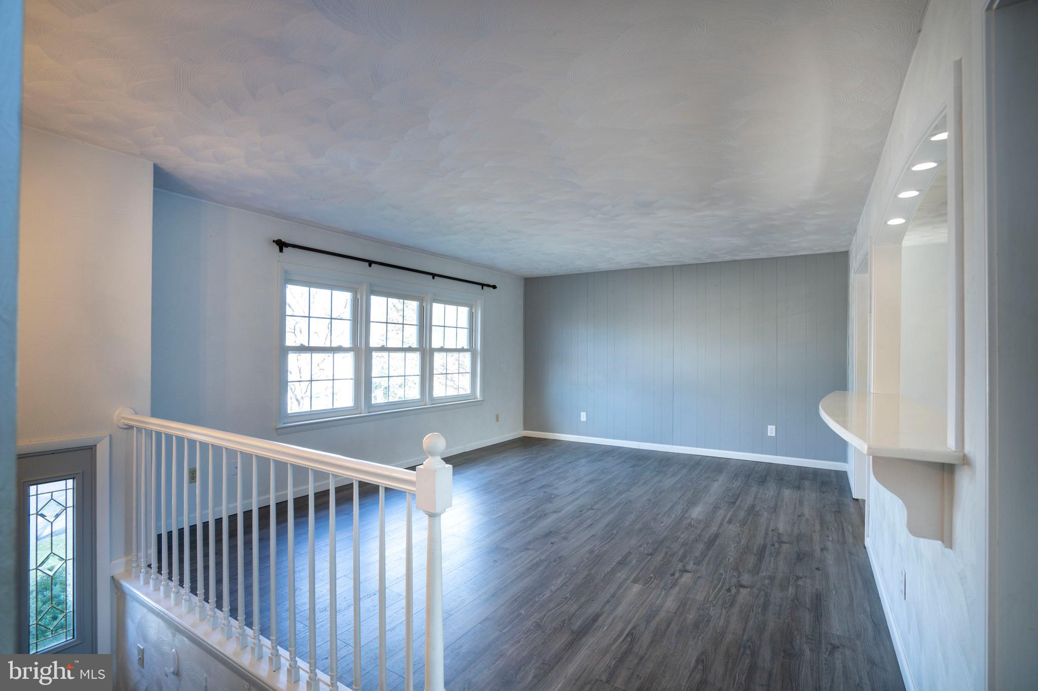2510 Buchenhorst Road State College, PA 16801 - Photo 20 of 64 a view of an empty room with wooden floor and a window