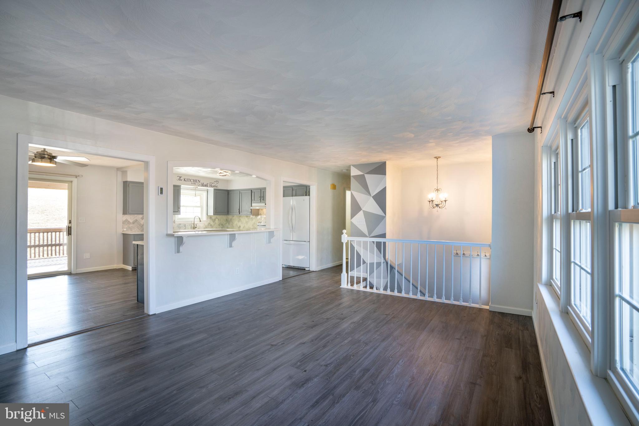 2510 Buchenhorst Road State College, PA 16801 - Photo 23 of 64 a view of a big room with wooden floor and windows
