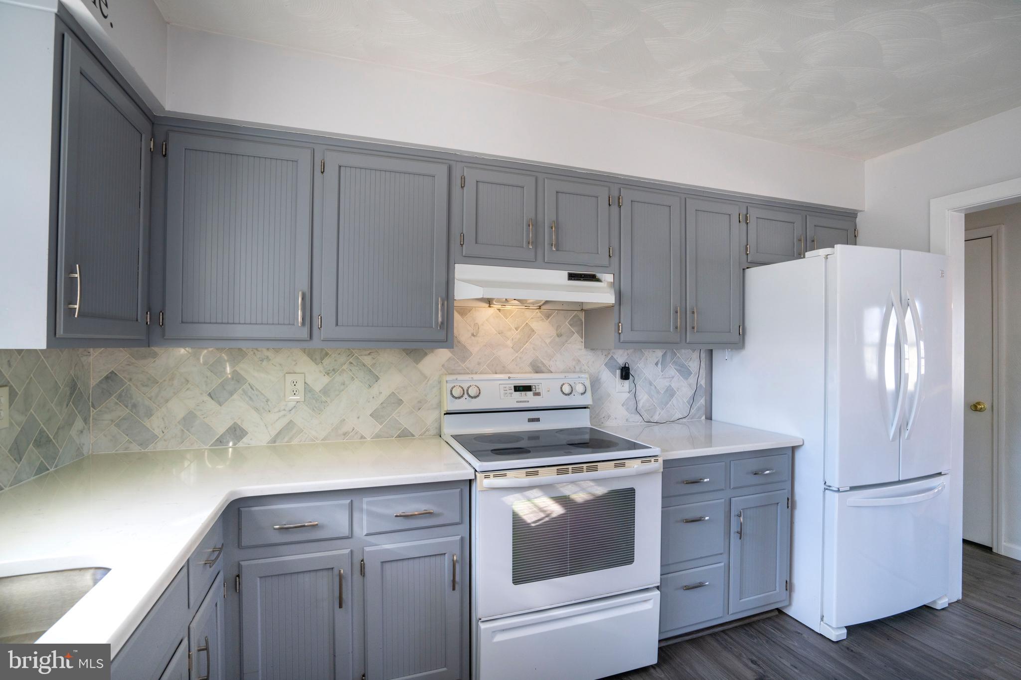 2510 Buchenhorst Road State College, PA 16801 - Photo 31 of 64 a kitchen with stainless steel appliances white cabinets and white appliances