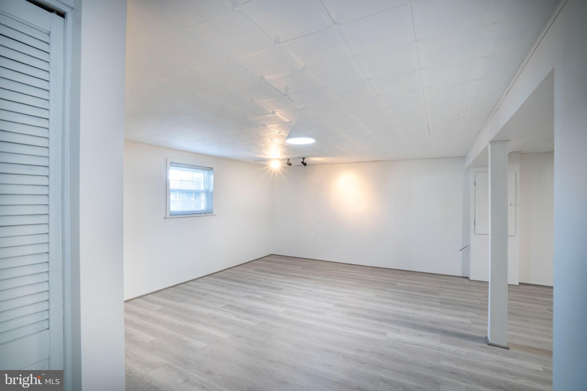 2510 Buchenhorst Road State College, PA 16801 - Photo 52 of 64 an empty room with wooden floor and windows