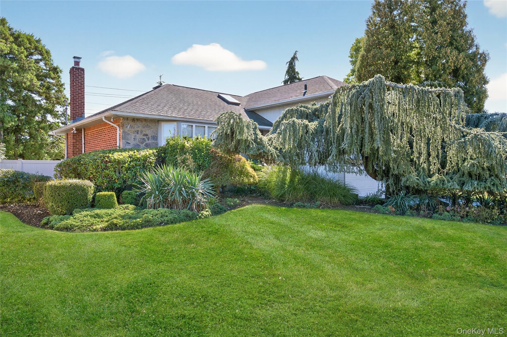 11 Sunbeam Road Syosset, NY 11791 - Photo 3 of 28 Front of home, showing beautiful mature trees and landscaping