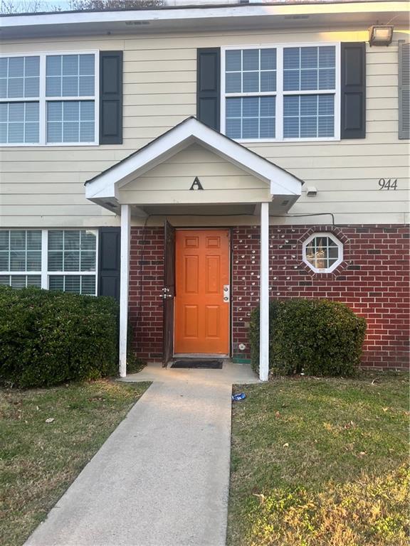 944 Old Mill Point Monroe, GA 30655 - Photo 1 of 8 a front view of a house with garden