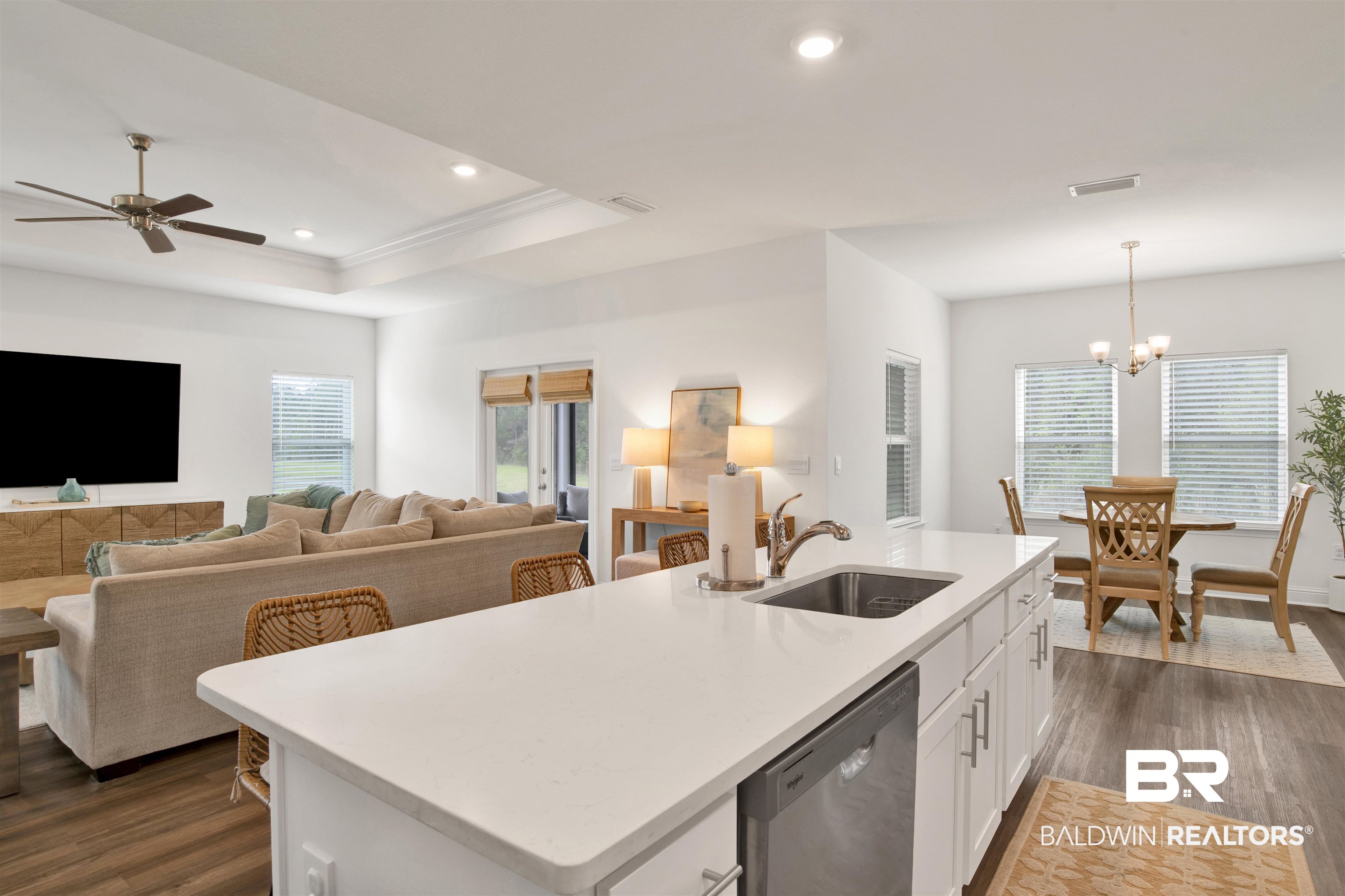 594 Shepard Street Gulf Shores, AL 36542 - Photo 51 of 51 Kitchen with open floor plan, dark wood-style floors, dishwasher, an island with sink, and white cabinets