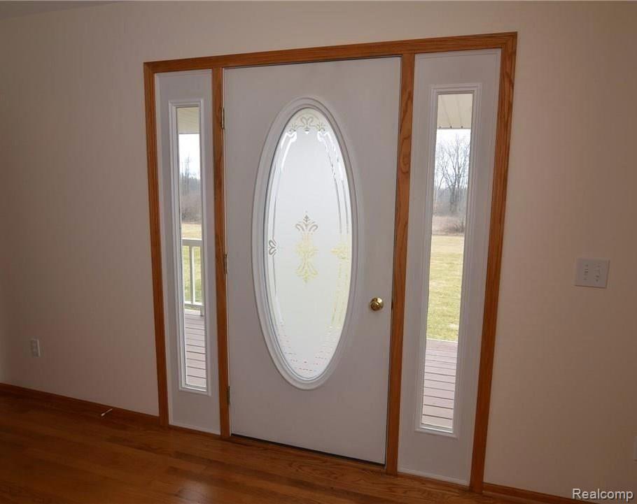 2312 Musson Road Howell, MI 48855 - Photo 6 of 29 FROSTED GLASS ENTRY OPENS TO LARGE FOYER
