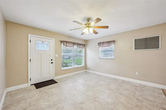 a view of an empty room with a window