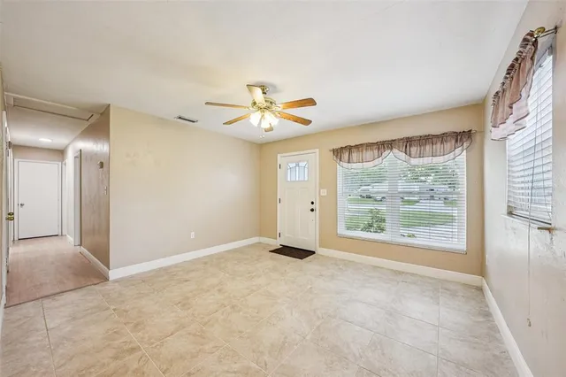 a view of an empty room with a window