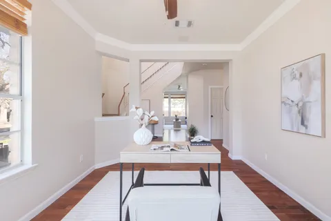 a view of a dining room with furniture and wooden floor