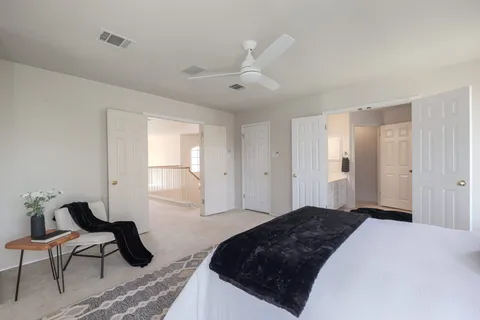 a bedroom with bed and window
