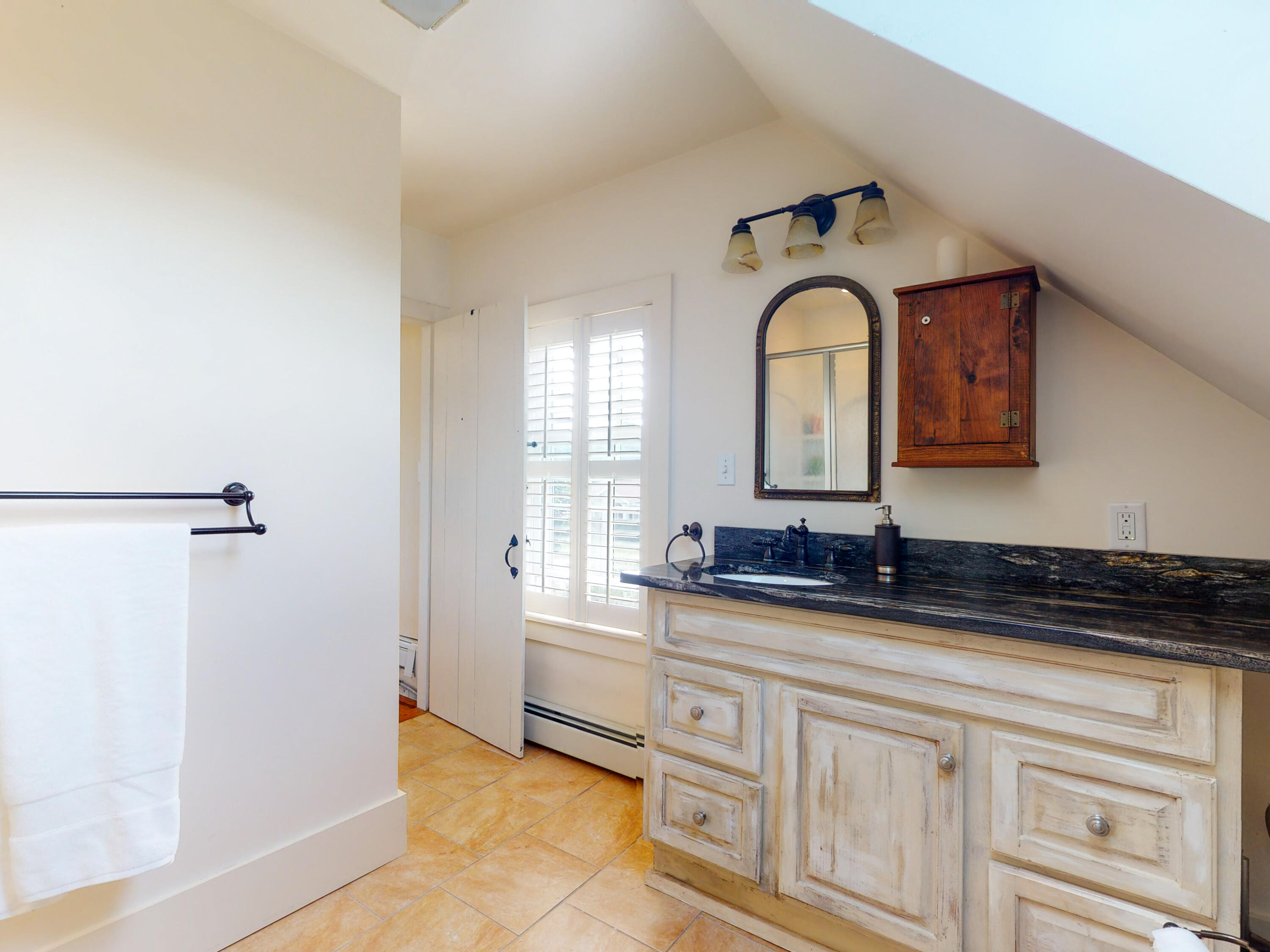 280 Chatham Road Harwich, MA 02645 - Photo 24 of 45 a bathroom with a granite countertop sink and a mirror