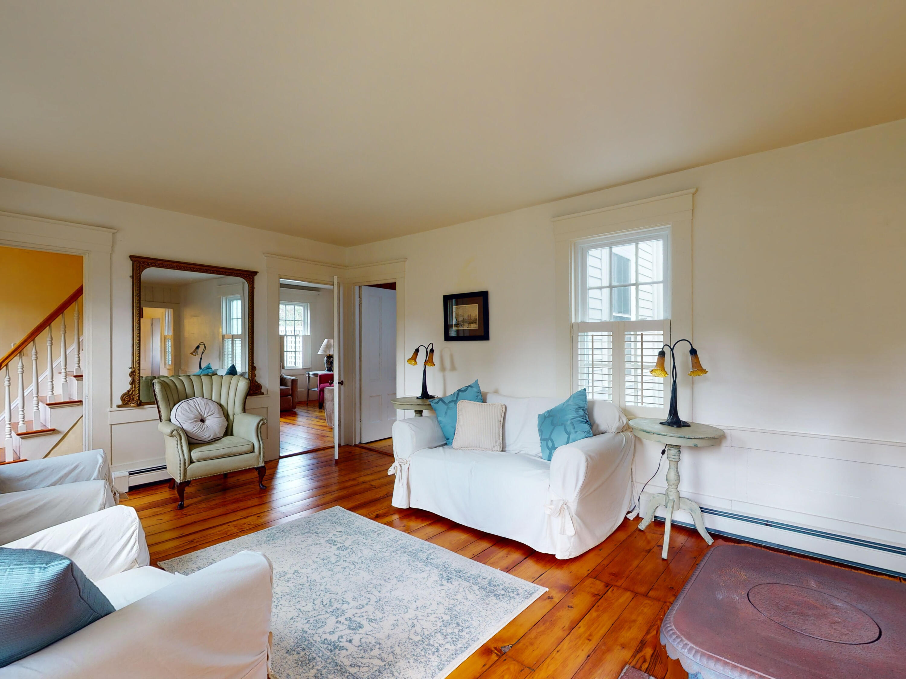 280 Chatham Road Harwich, MA 02645 - Photo 4 of 45 a living room with furniture and a lamp