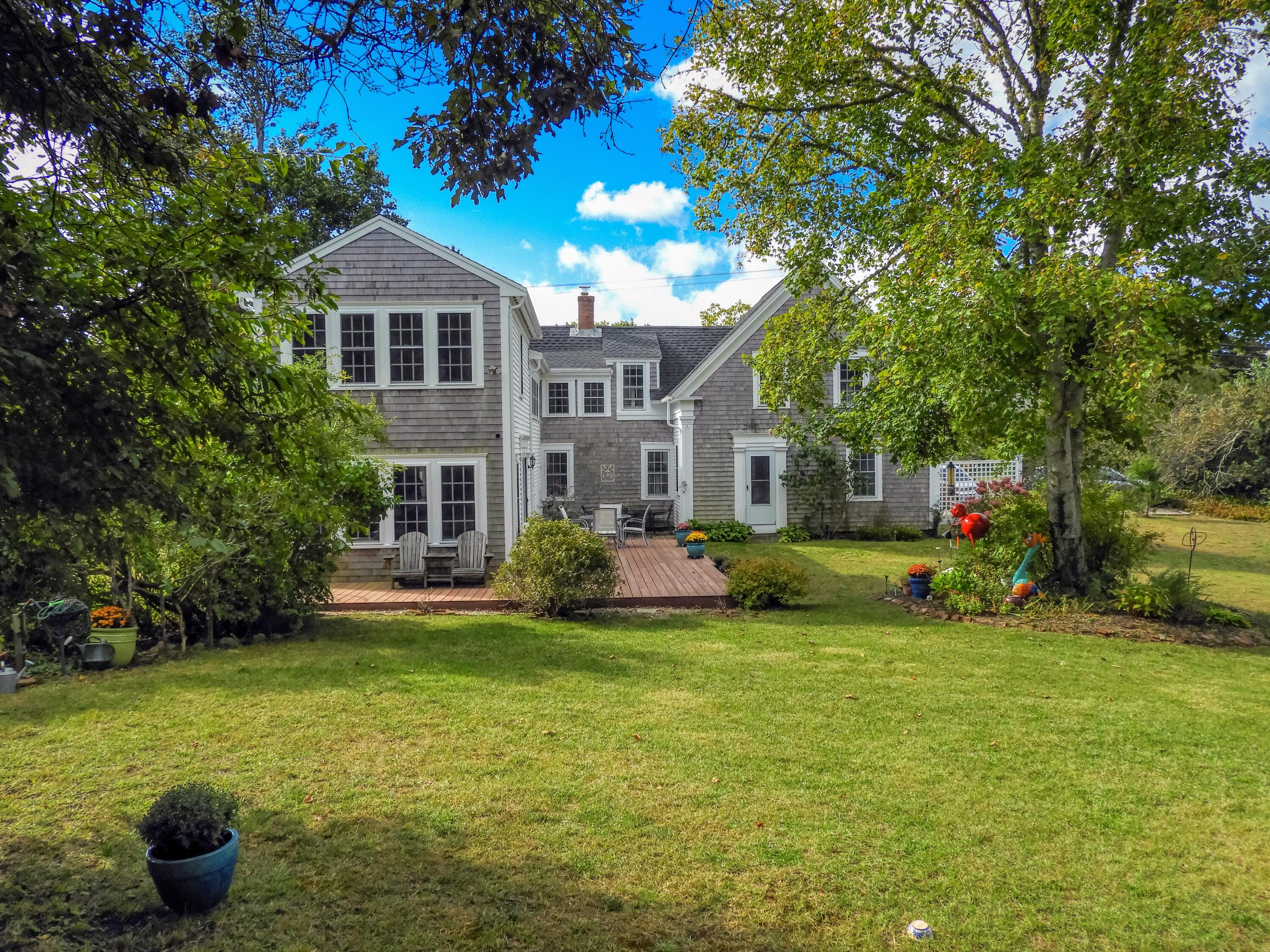 280 Chatham Road Harwich, MA 02645 - Photo 42 of 45 a front view of a house with a yard porch and sitting area