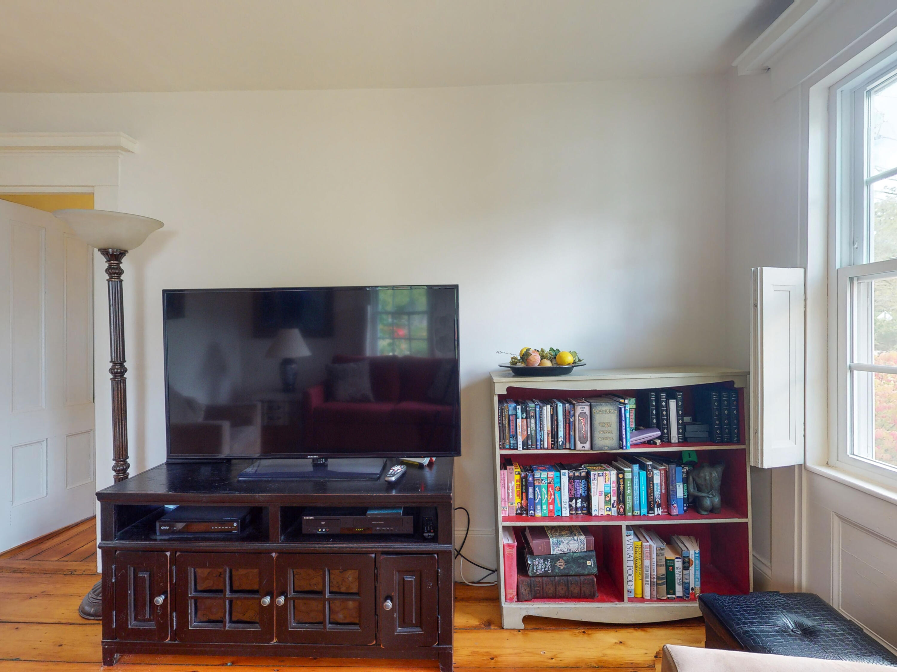 280 Chatham Road Harwich, MA 02645 - Photo 9 of 45 a living room with furniture and a book shelf
